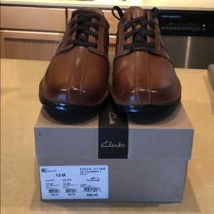 Men’s Clark’s brown leather dress shoes.